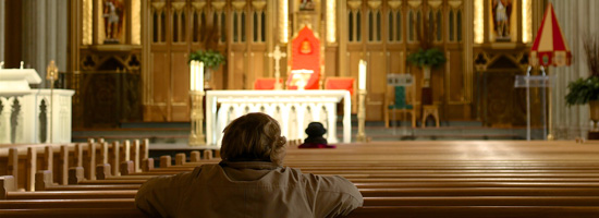 Parishioner praying